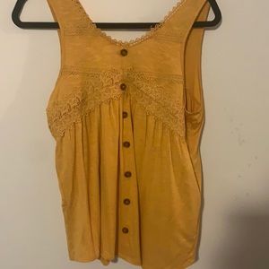 A yellow shirt for juniors in the size medium